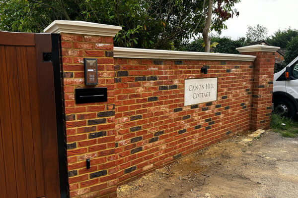 Brick wall with house name