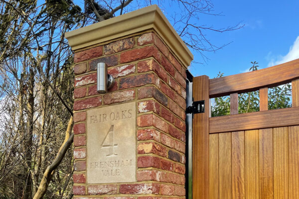Brick pillar with gate and house name